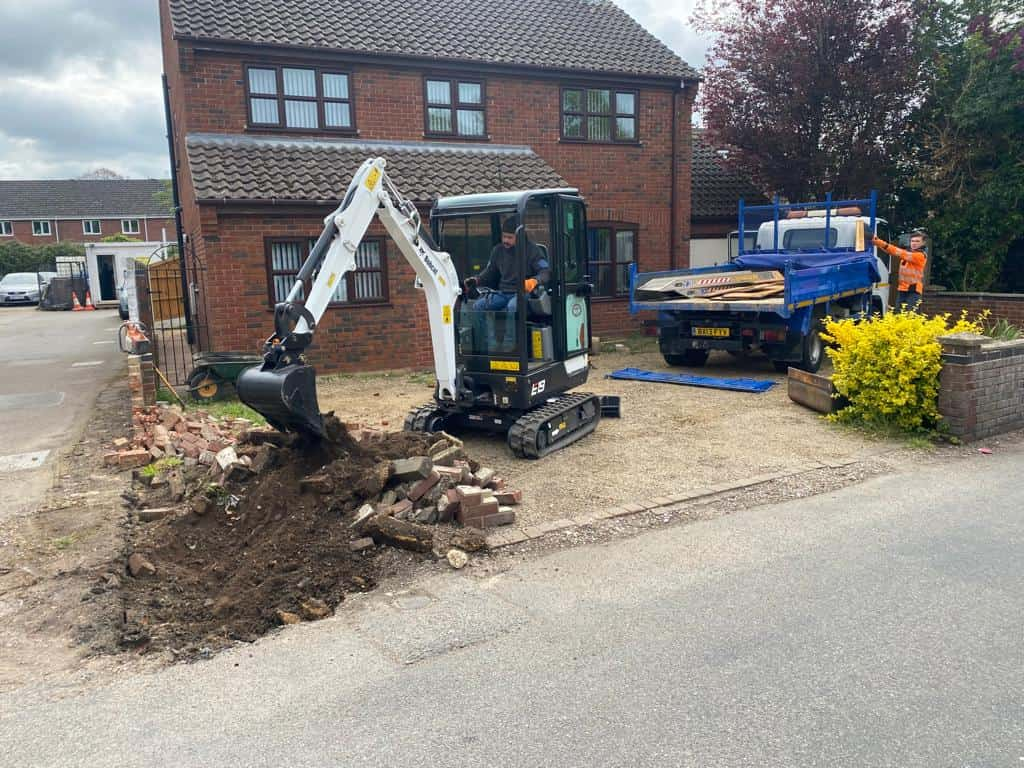 This is a photo of an operative of Milton Driveways Digging out for a new tarmac driveway