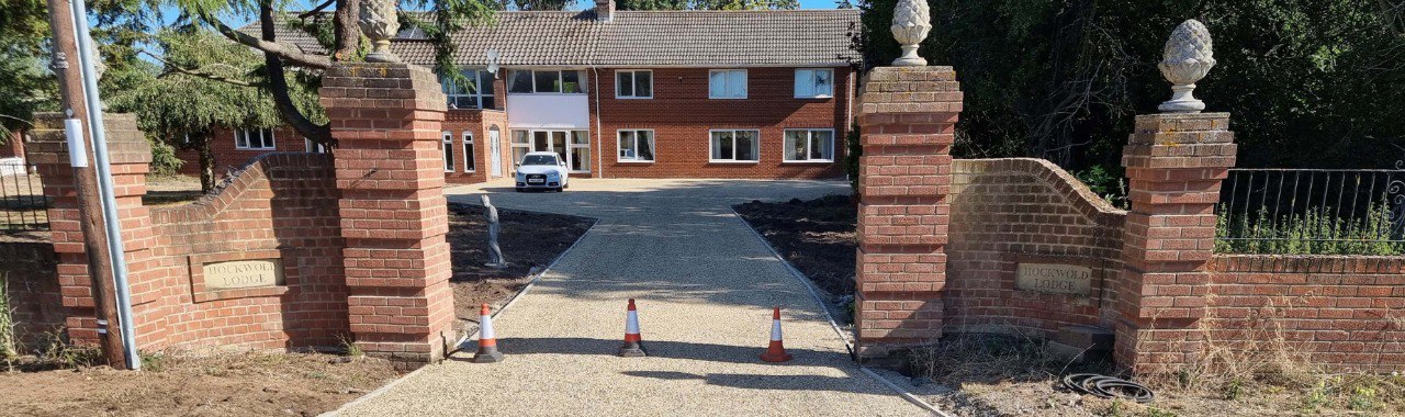This is a photo of a newly installed chip and tar driveway, installed by Milton Driveways